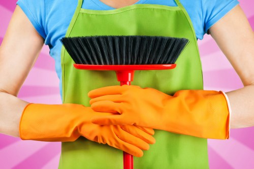 Professional cleaners handling dust and debris after renovation work