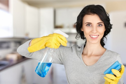 Staff member applying safe cleaning methods in a home interior
