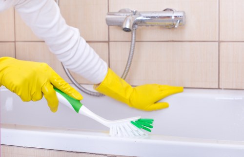 Local oven cleaner working in a Chelsea apartment kitchen